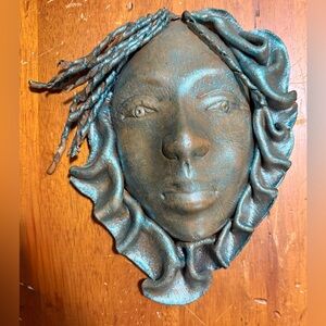 Handcrafted Leather Face mask with headwrap,showing a unique artistic style.